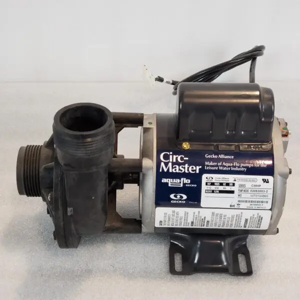 A pump that is sitting on the ground.