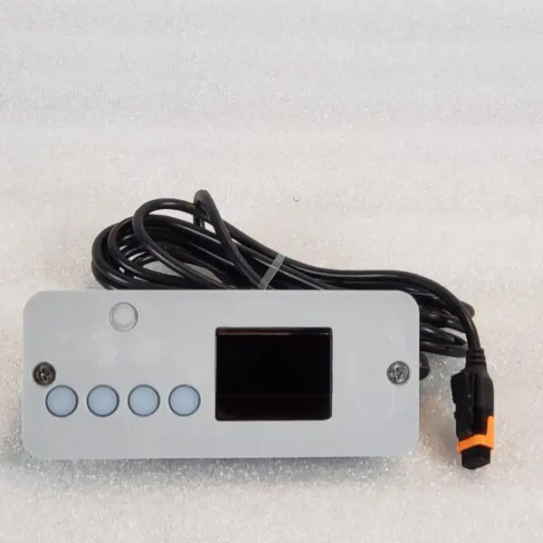 A white device with an orange button and black cord.