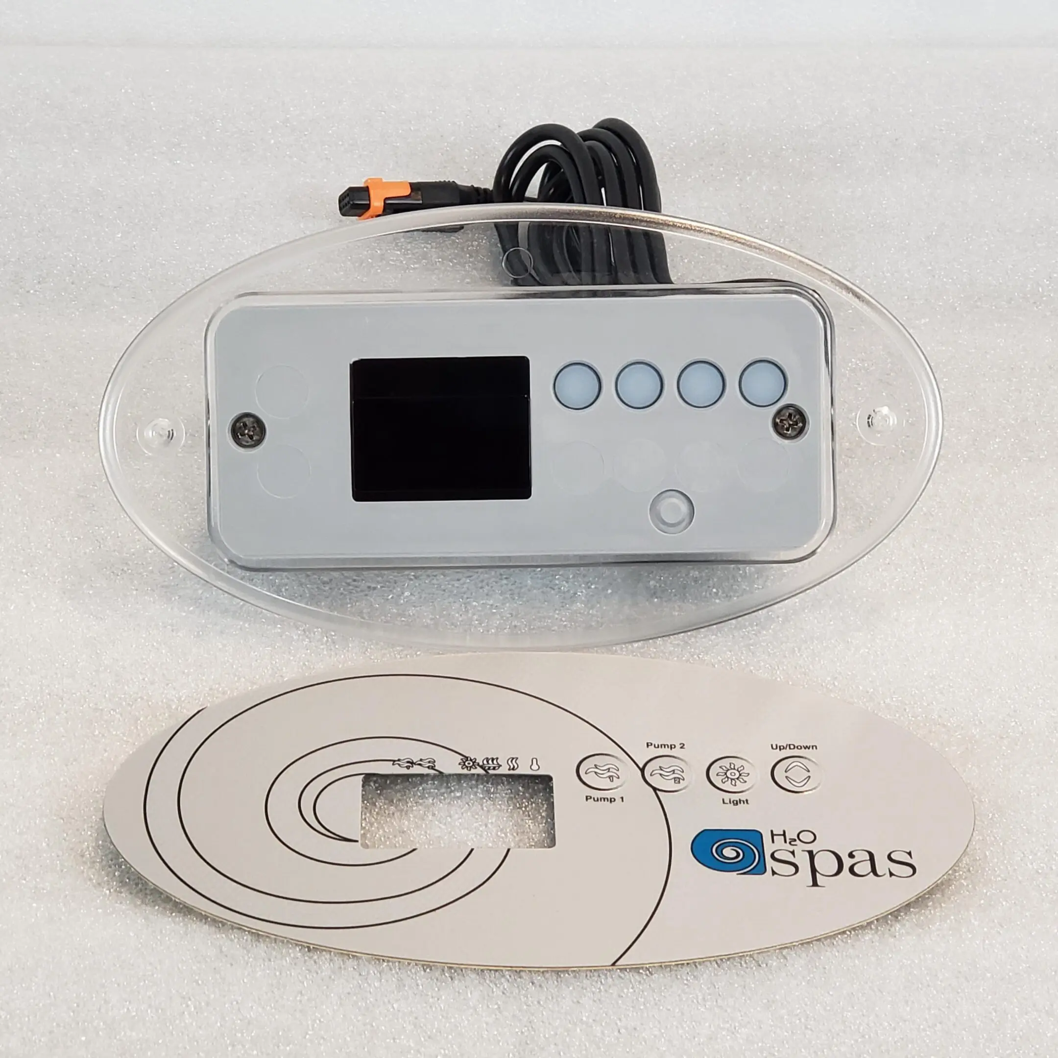 A remote control is shown next to the logo of spas.