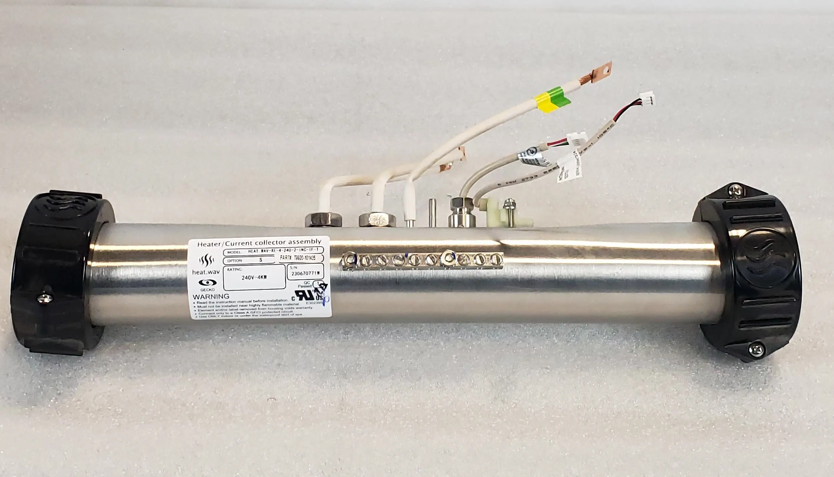 A close up of the wires on a stainless steel tube