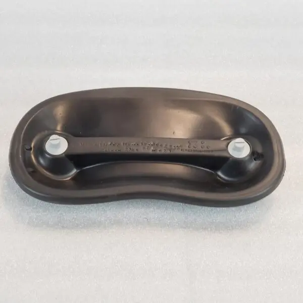 A black plastic handle with two metal plates.