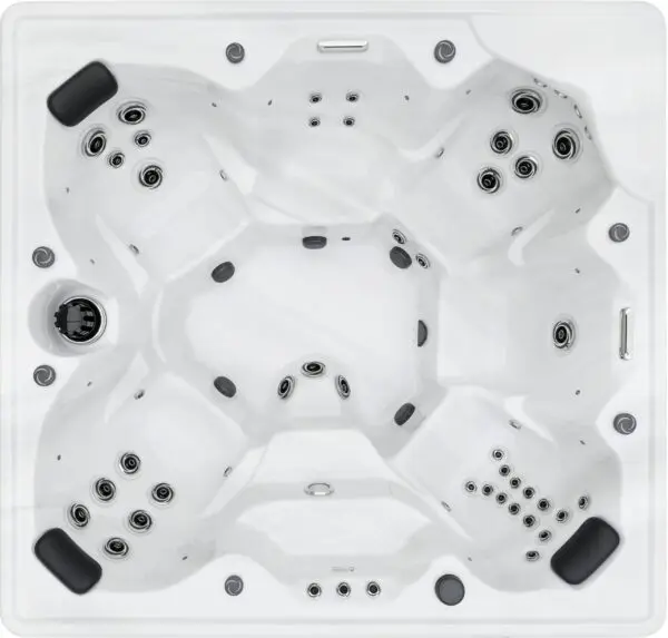 A white spa with black accents and no liner.