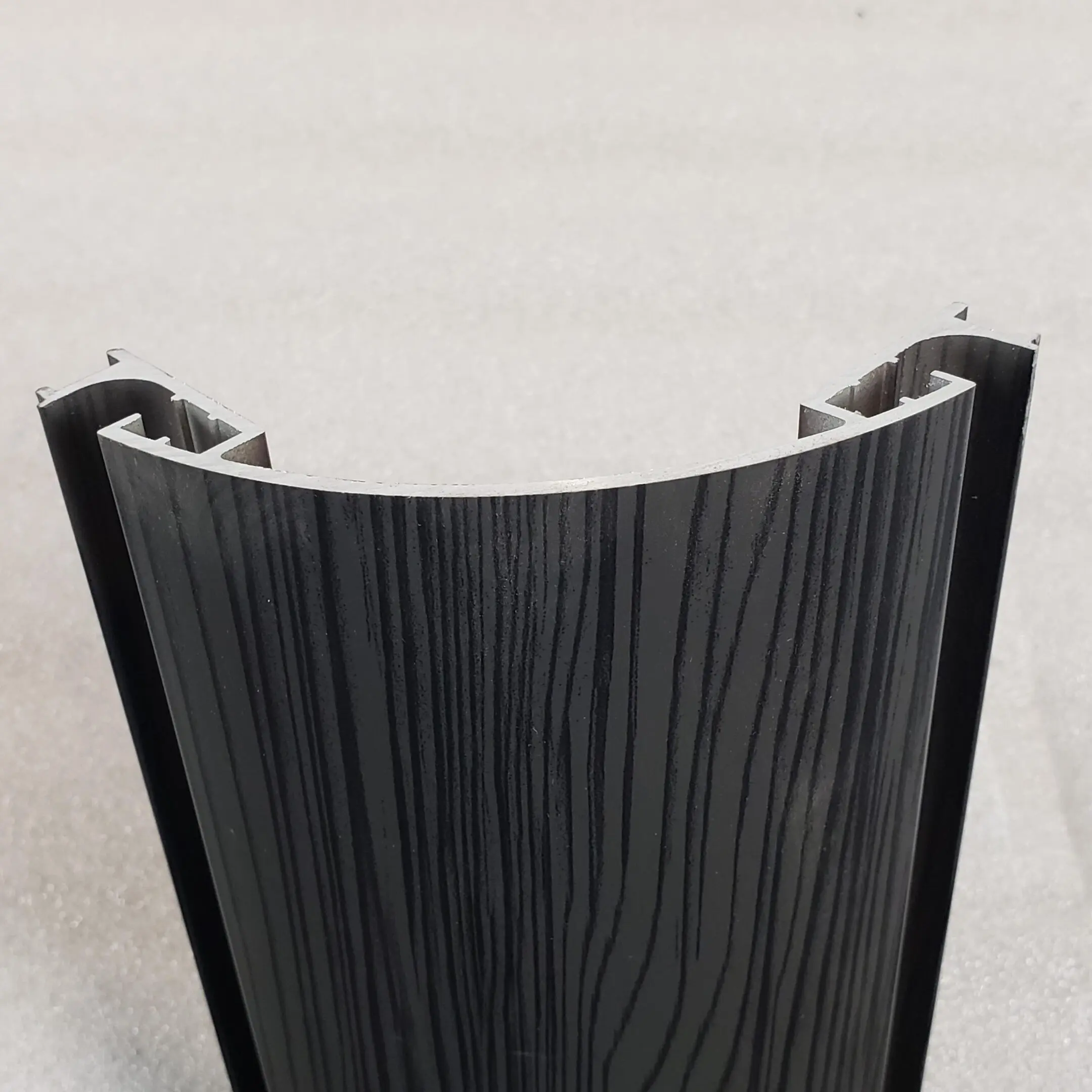 A close up of the side of a black and white wooden table