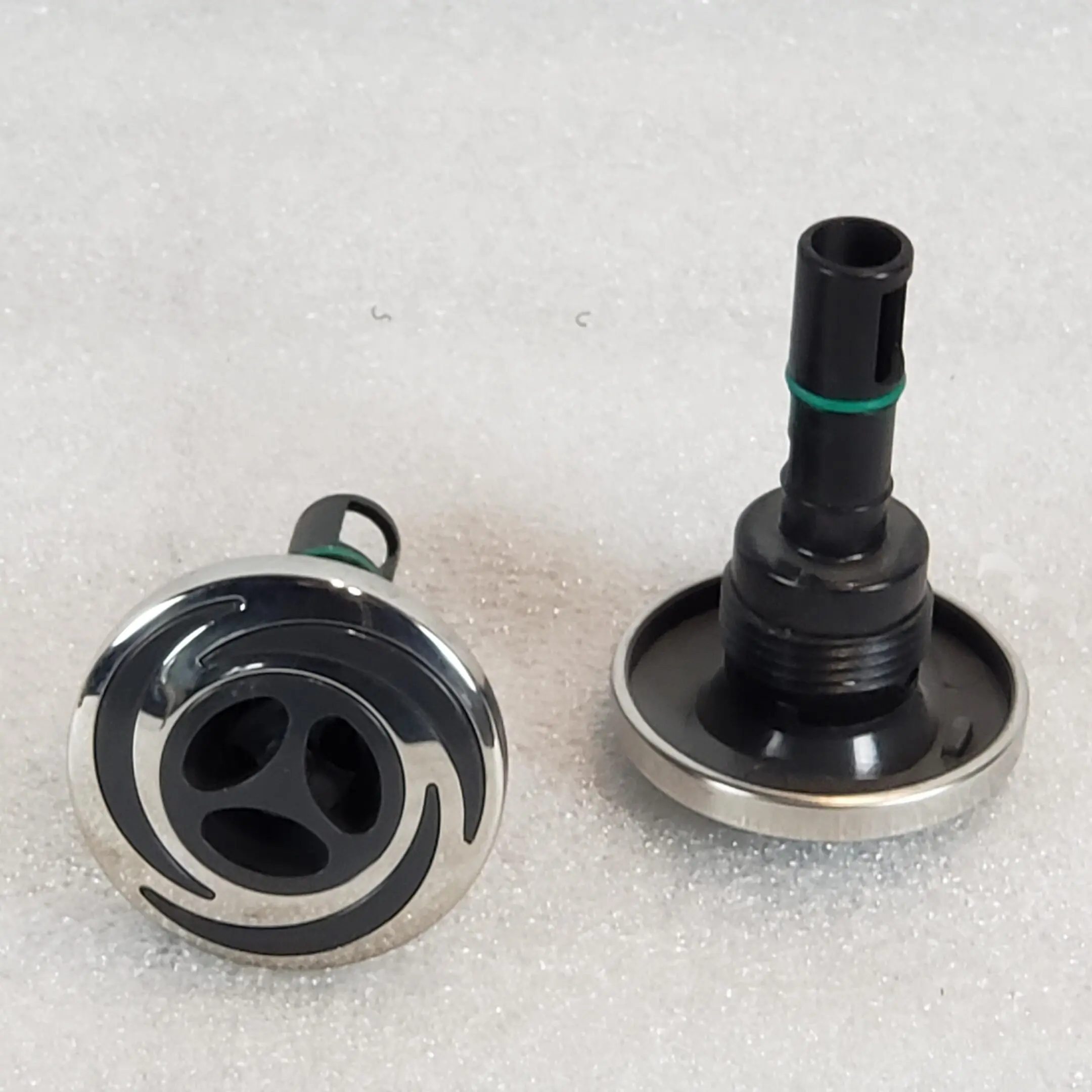 A pair of valves with the cap removed.