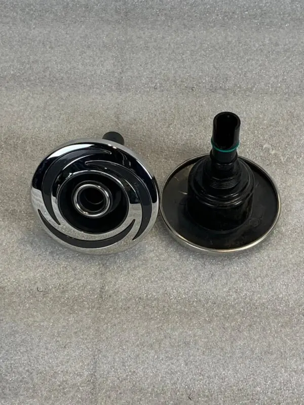 A pair of knobs with the same color on each side.
