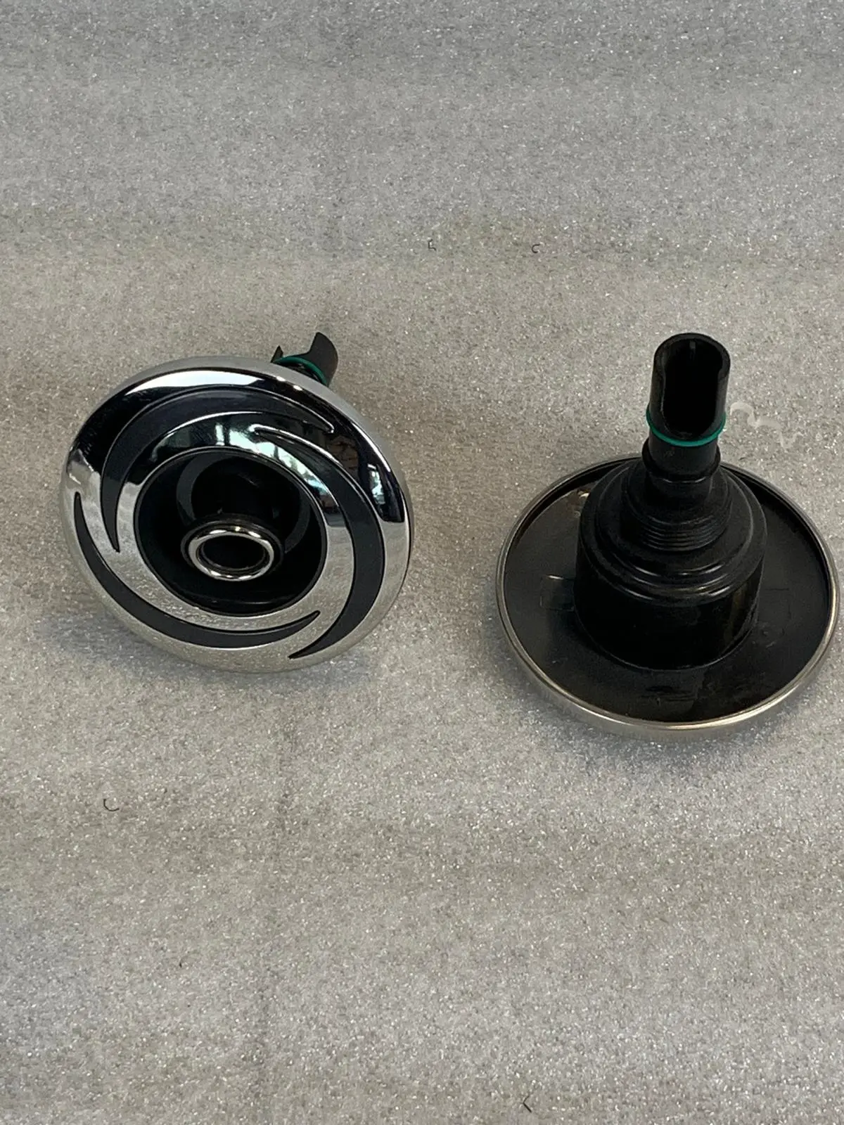 A pair of knobs that are sitting on the floor.