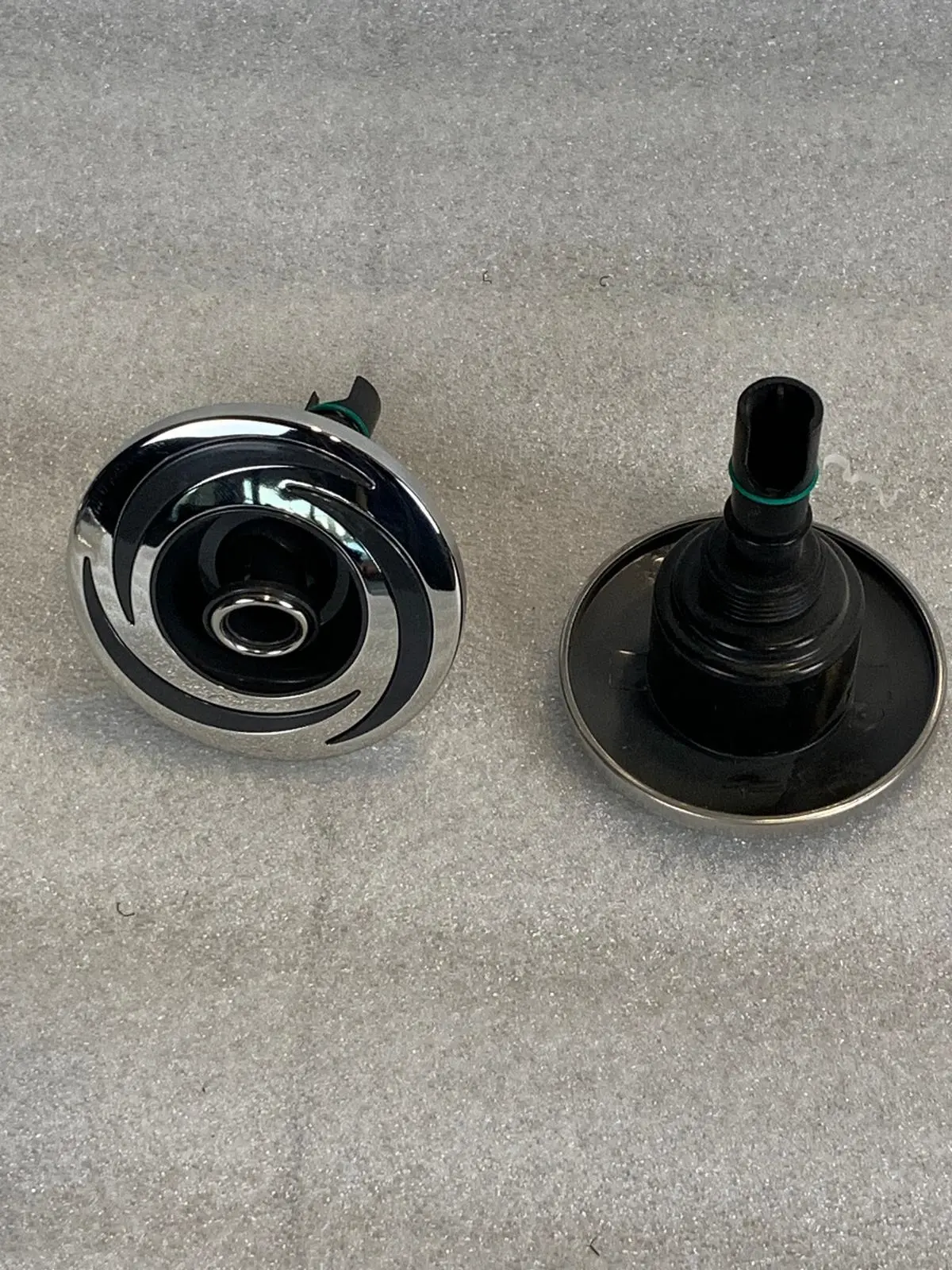 A pair of knobs that are sitting on the floor.