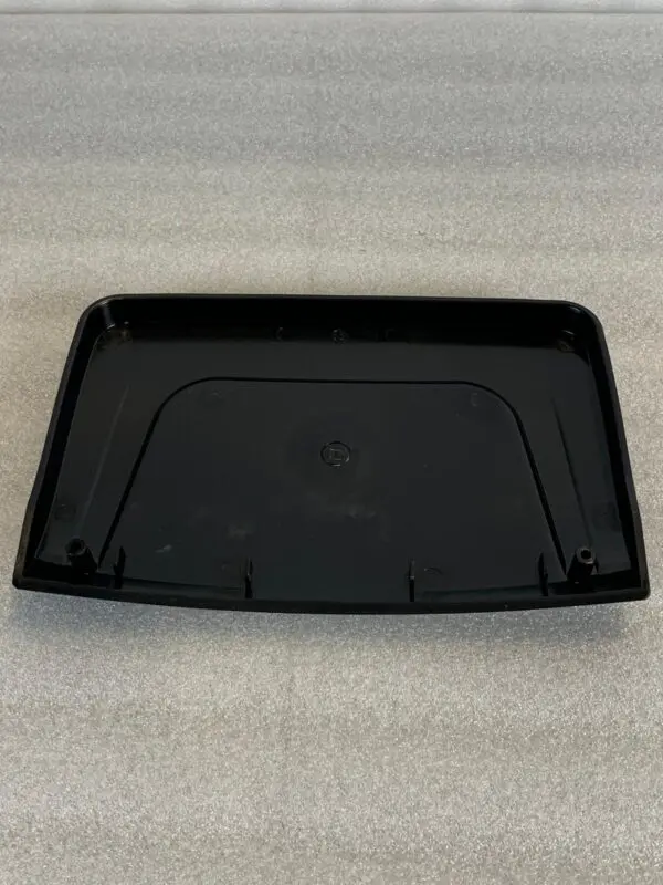 A black tray sitting on top of a table.