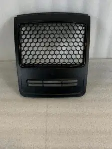 A black grill with a honeycomb design on it.