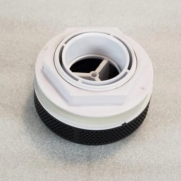 A white and black container sitting on top of a floor.