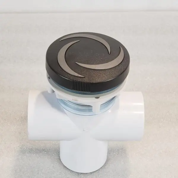 A white pipe with a black and silver lid.