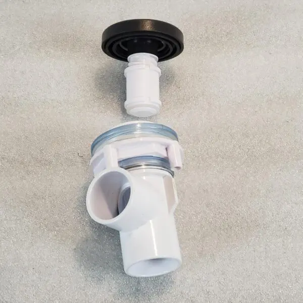 A white toilet with a black handle and a plunger.