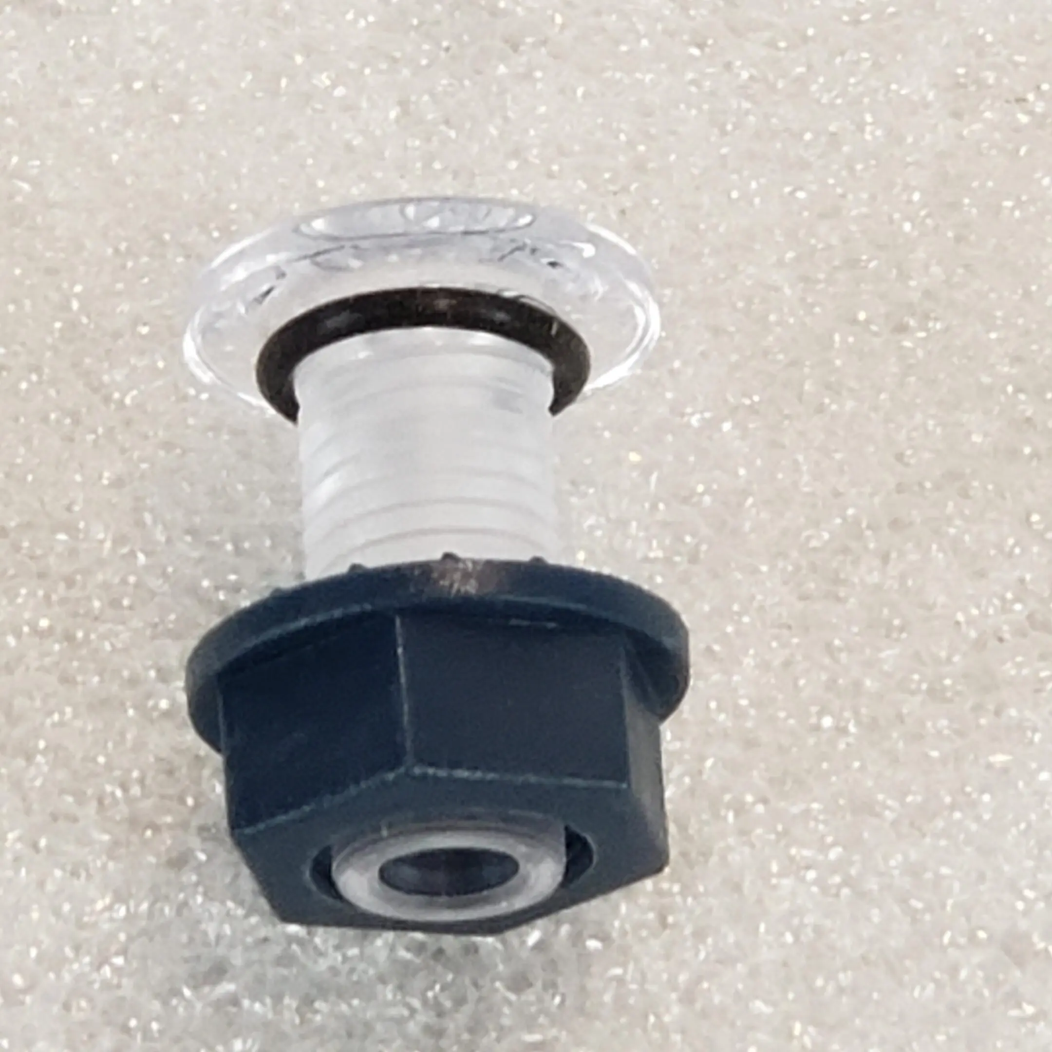 A black and white photo of a plastic object.