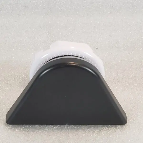 A black and white object sitting on top of the floor.