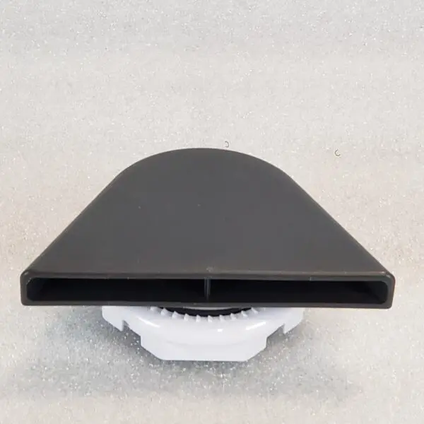 A black and white object sitting on top of the floor.