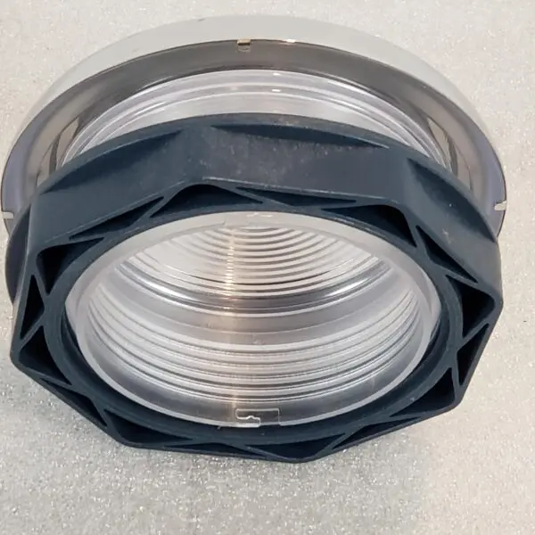 A close up of the top part of a light fixture