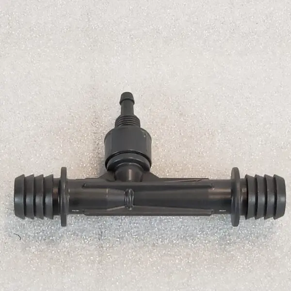 A black plastic pipe with an outlet on it.