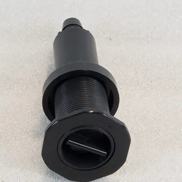 A black plastic tube with a hole in it.