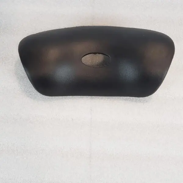 A black object is hanging on the wall.