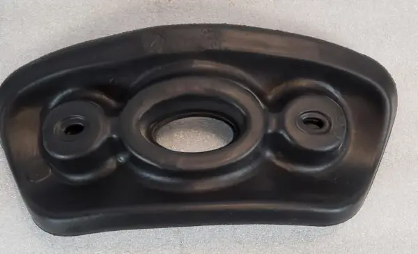 A black plastic object sitting on top of a table.