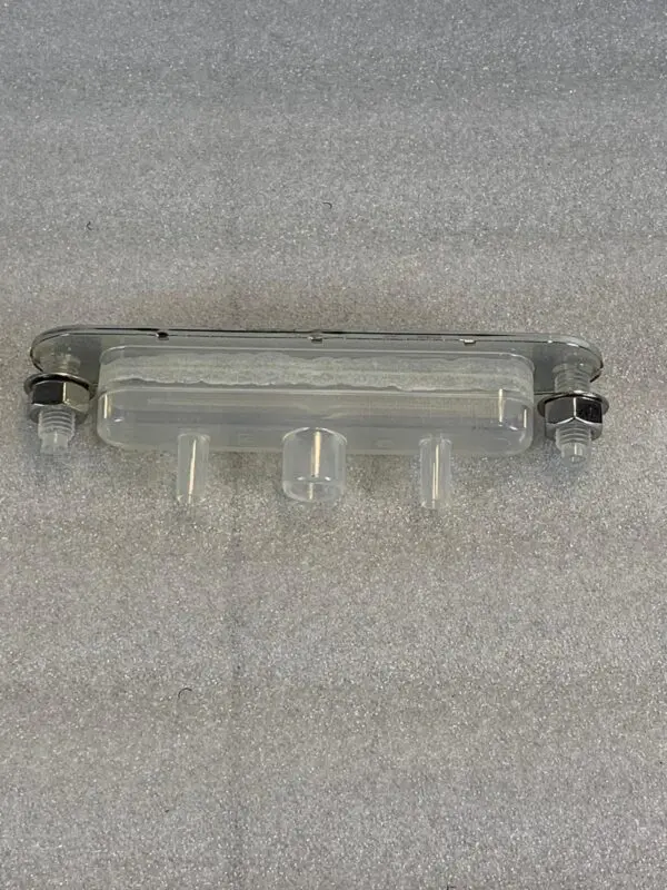 A plastic object is shown on the floor.