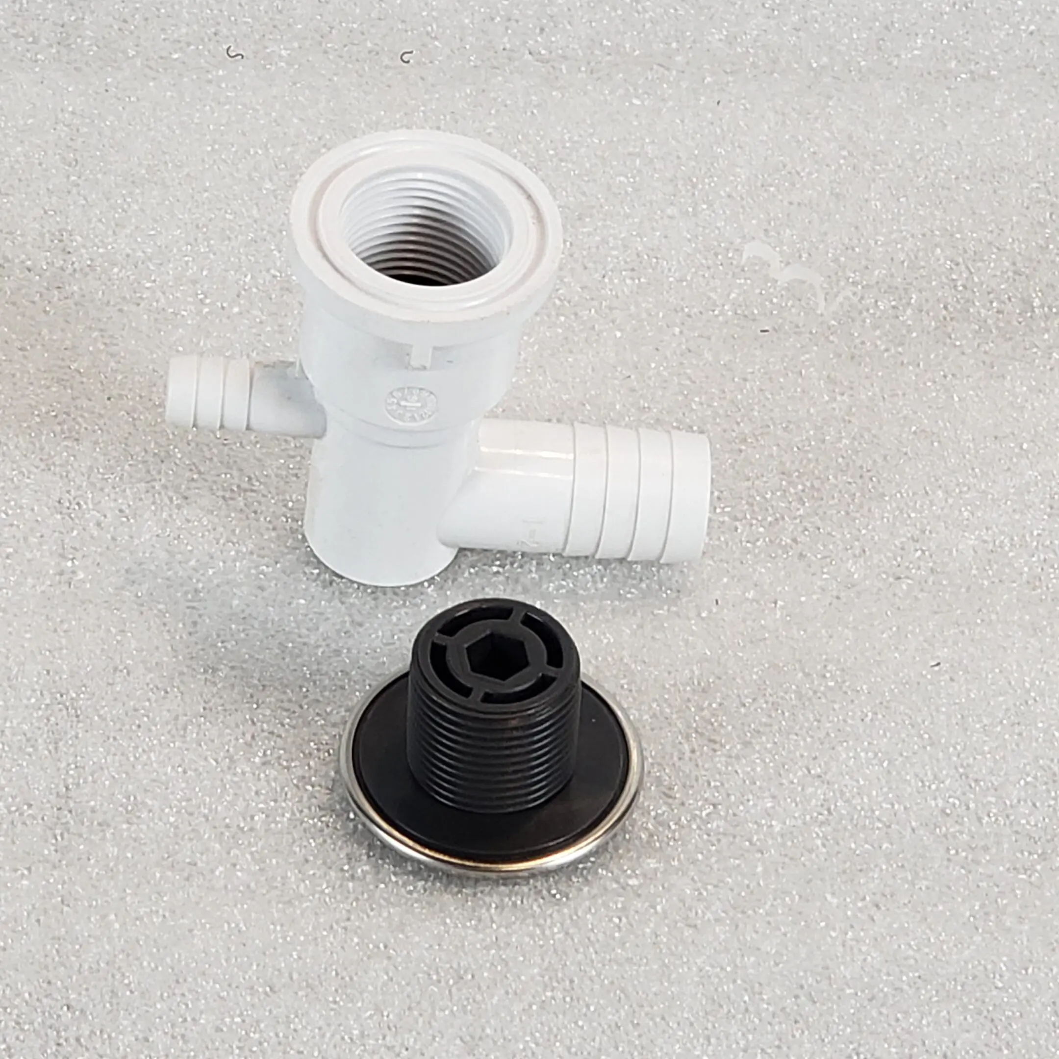 A black and white picture of a water faucet.