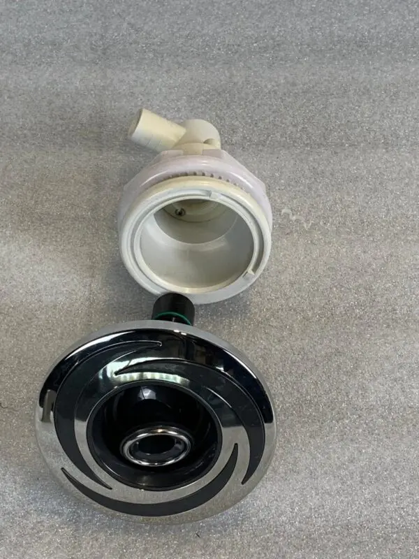 A black and white toilet bowl with the lid open.