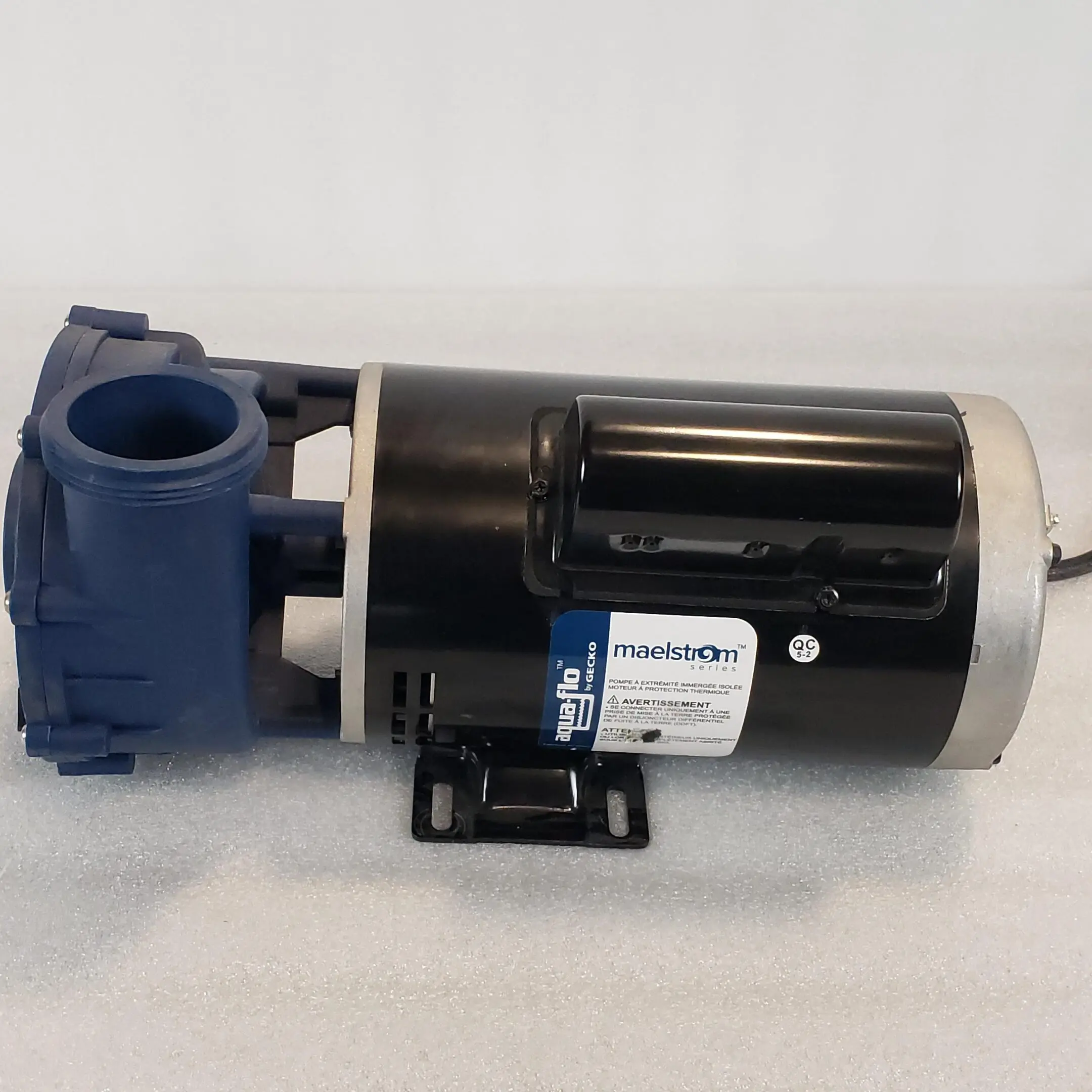 A pump that is sitting on the ground.