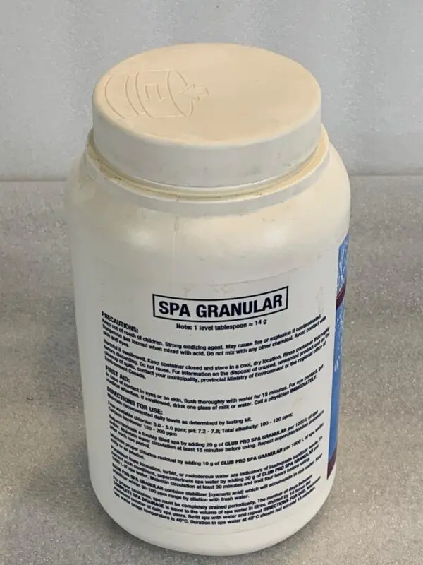 A tub of spa granular is sitting on the counter.