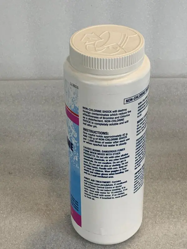 A bottle of toothpaste sitting on top of a counter.