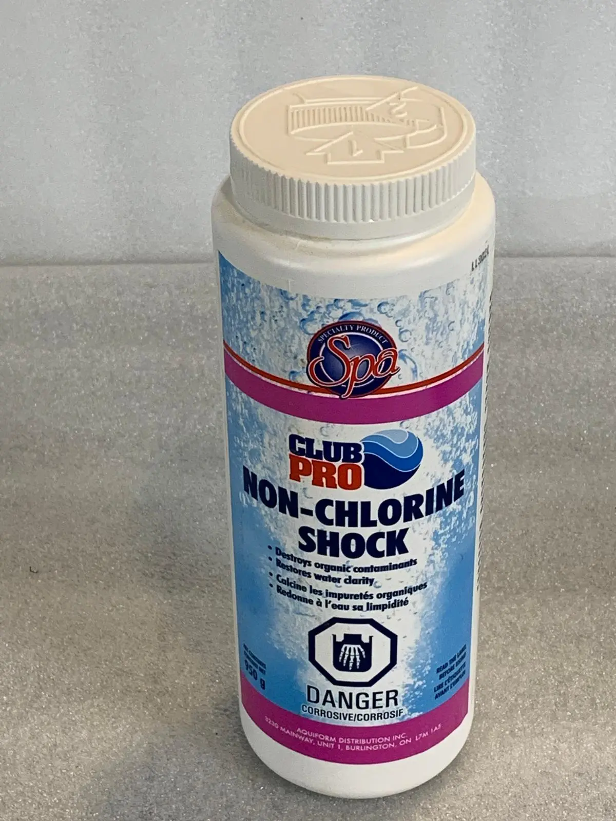 A bottle of non-chlorine shock is sitting on the counter.