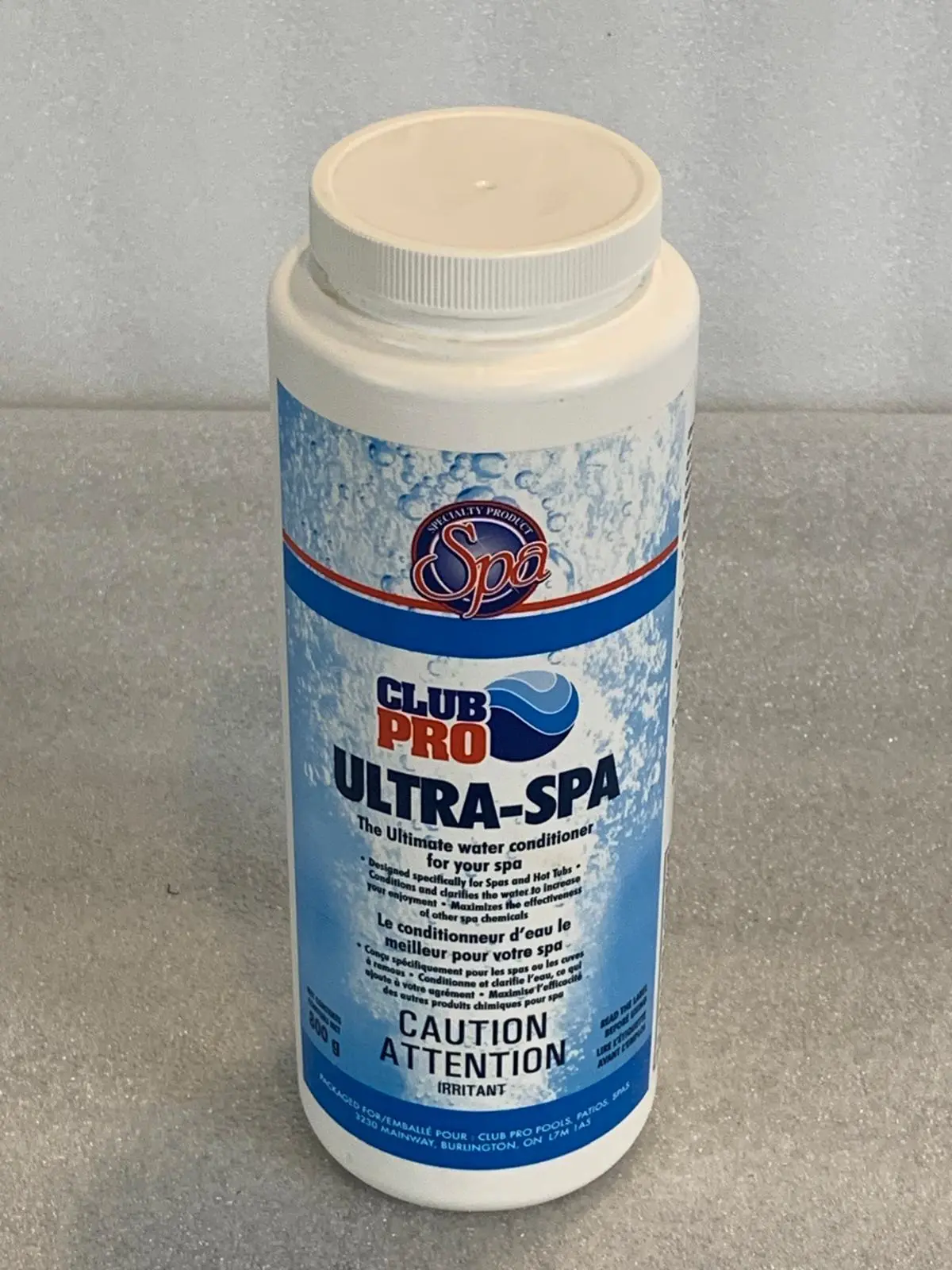A bottle of spa water on the counter.