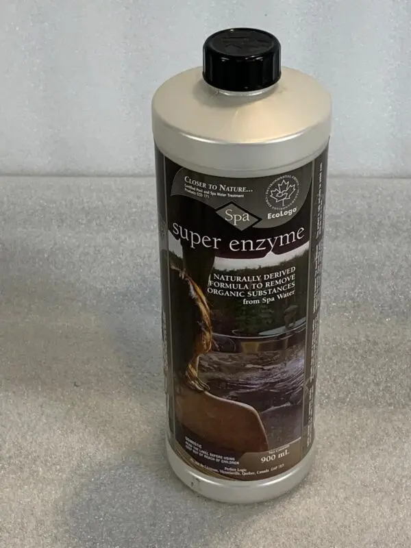 A bottle of liquid sitting on top of a counter.