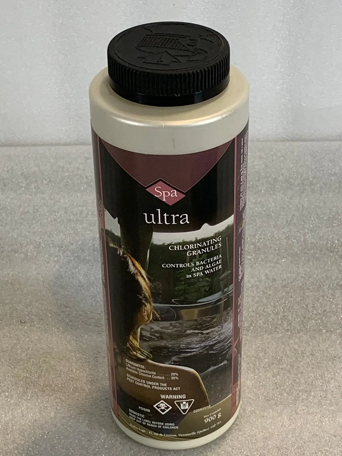 A bottle of ultra car wax sitting on top of a counter.