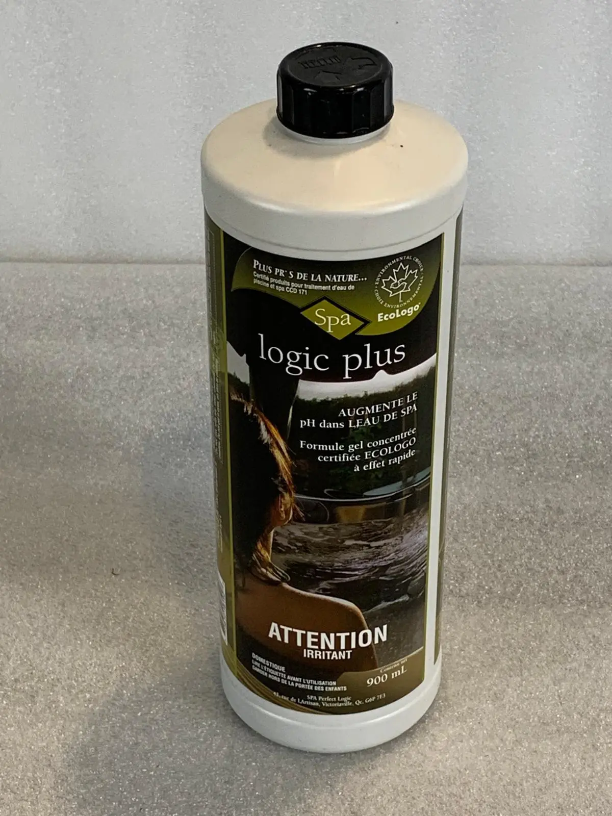 A bottle of liquid sitting on top of a counter.