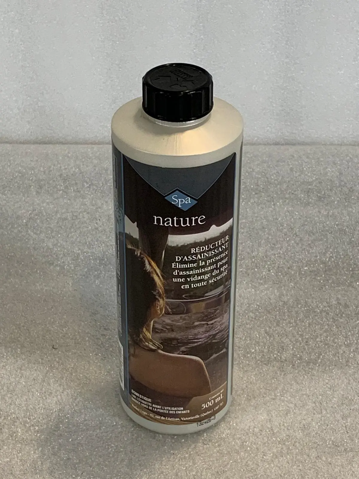A bottle of car wash soap sitting on top of a counter.