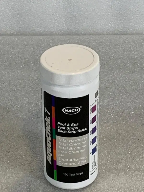 A white container of paint on top of a counter.