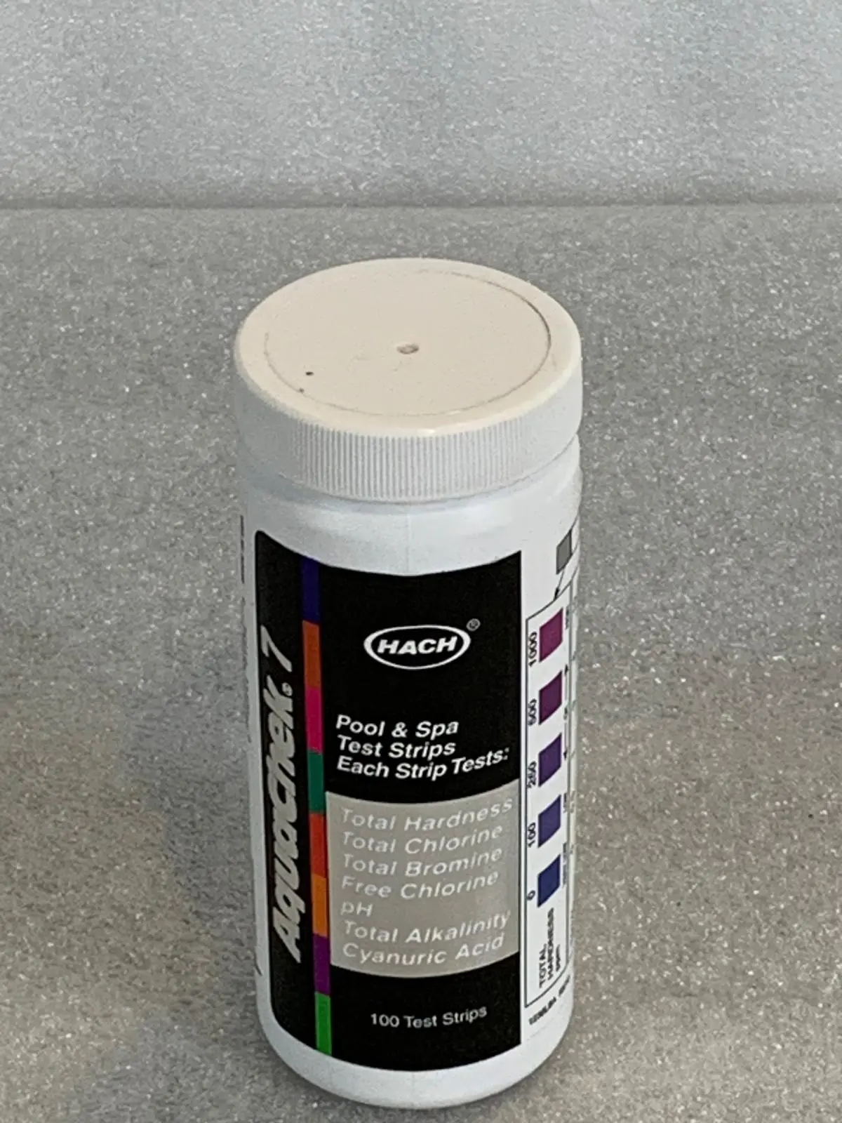 A white container of paint on top of a counter.