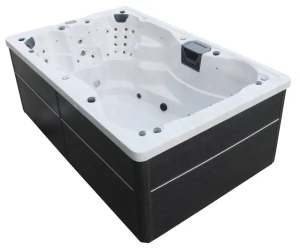 A black and white tub with a remote control