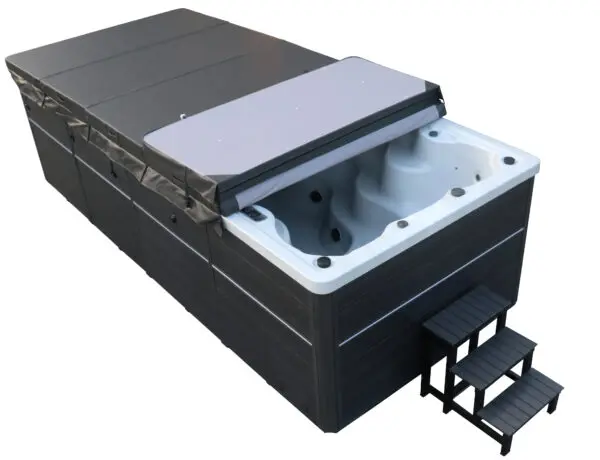 A black and white tub with steps on top of it
