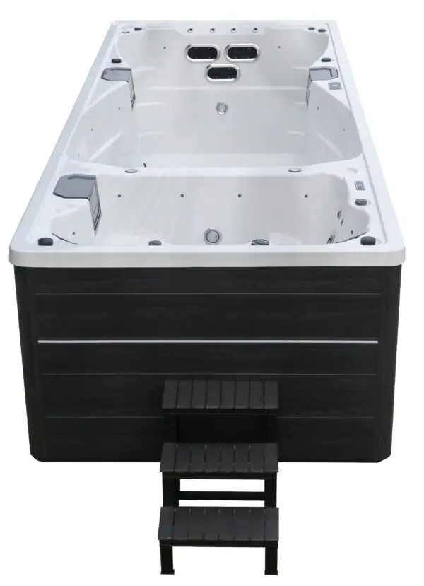 A black and white tub with steps on the side