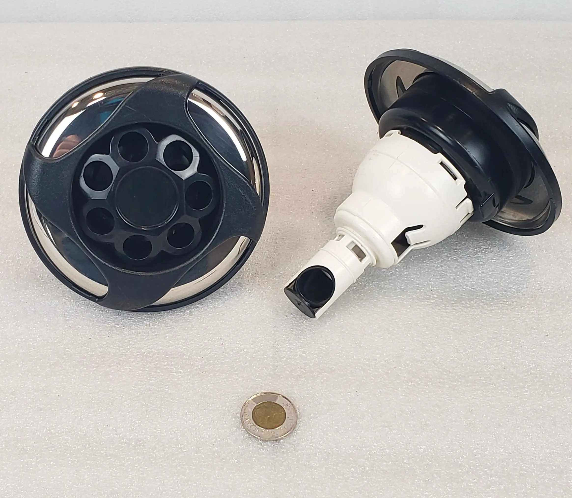 A black and white picture of a car horn.