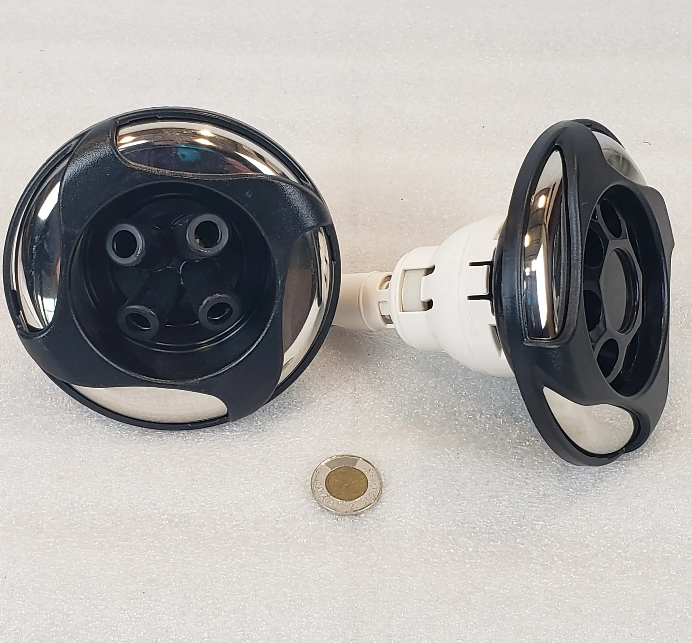 A pair of black and white plugs sitting on top of a table.