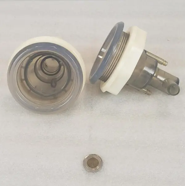 A white and silver faucet with a metal knob.