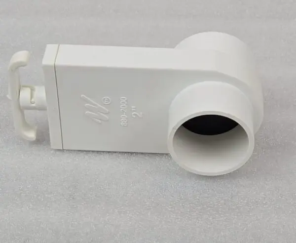 A white pipe sitting on top of a table.
