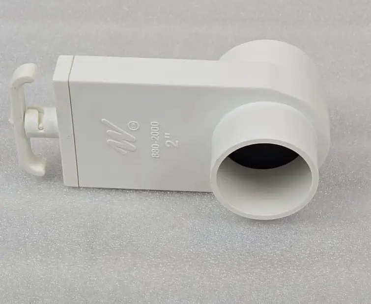 A white pipe sitting on top of a table.