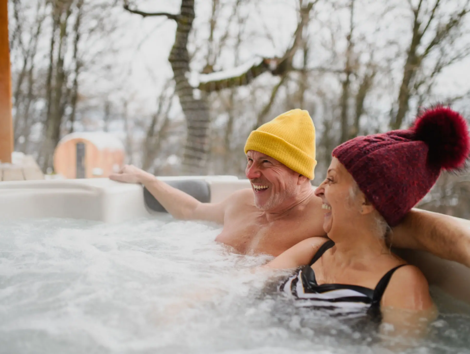 blob-08833dd Two people in a hot tub with trees in the background